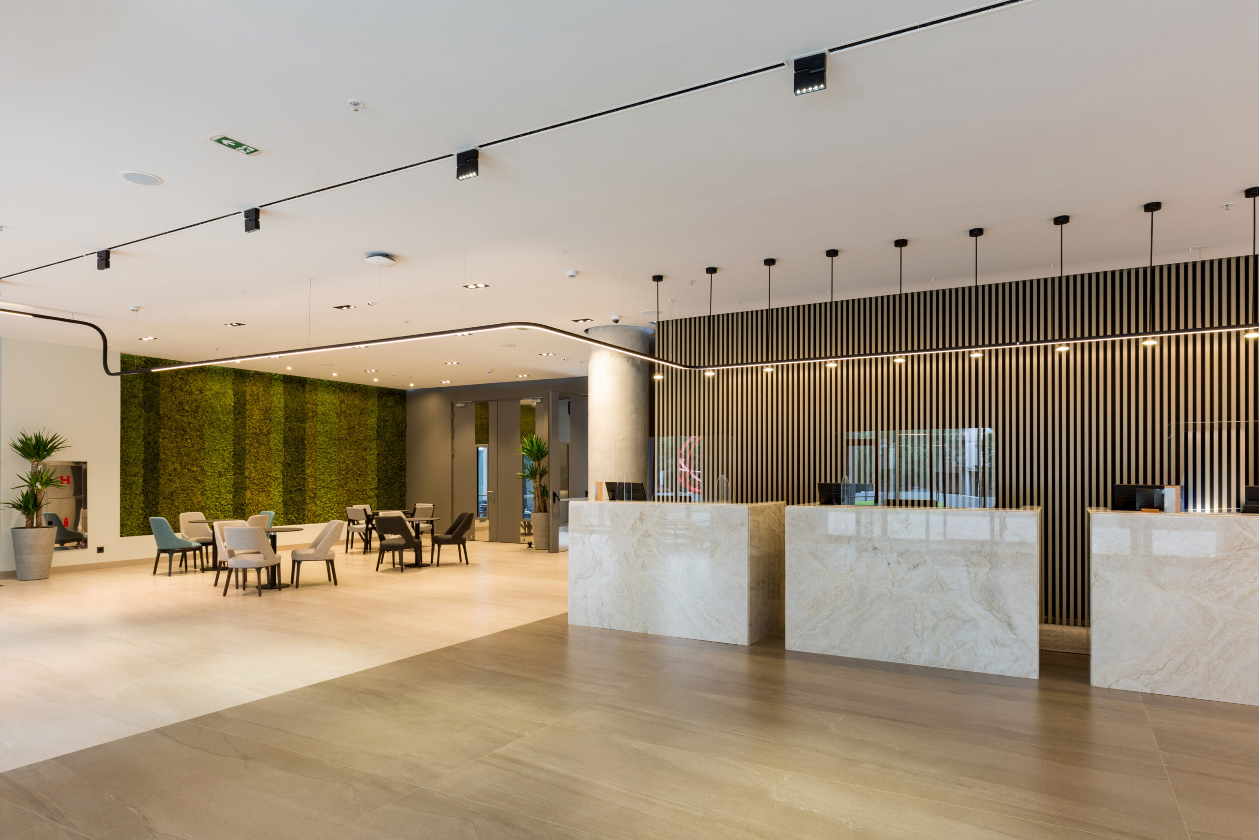 Interior of a hotel lobby with reception desks with transparent Interior of a hotel lobby with reception desks with transparent